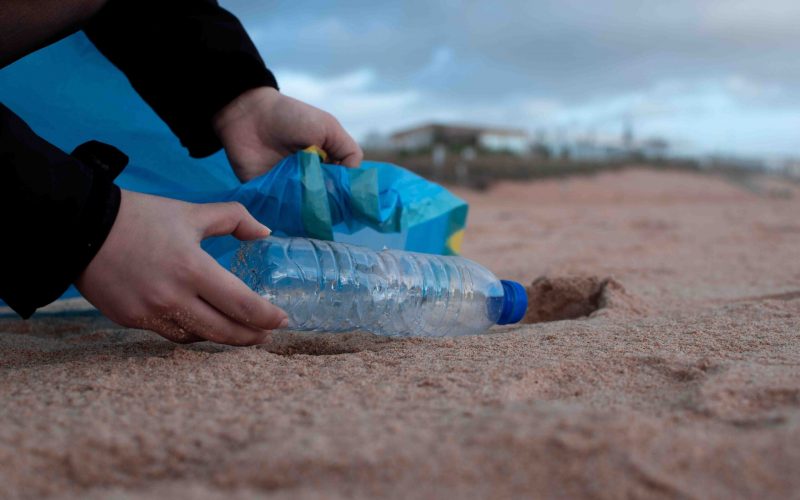 person-holding-clear-plastic-bottle-3480494-compressed